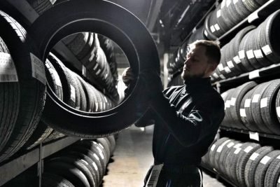 Mobile tyre fitting service Schofields technician repairing car tyre on site